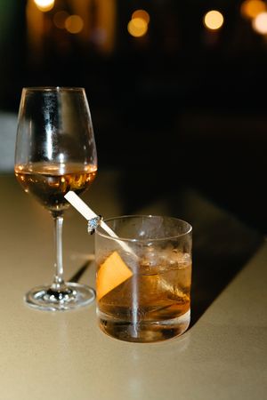 Editorial engagement. wedding and couples portraits on Sea Island, Georgia, engagement ring close up with the couple's favorite drinks