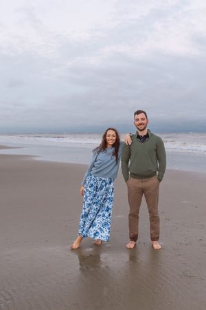 Newly engaged couple enjoying a rainy day photos in the Golden Isles of Georgia near the Westin on Jekyll Island