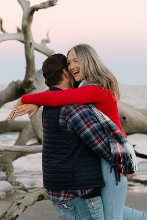 Engagement session on the beach in winter, driftwood beach engagement in the winter, christmas time engagement jekyll island georgia