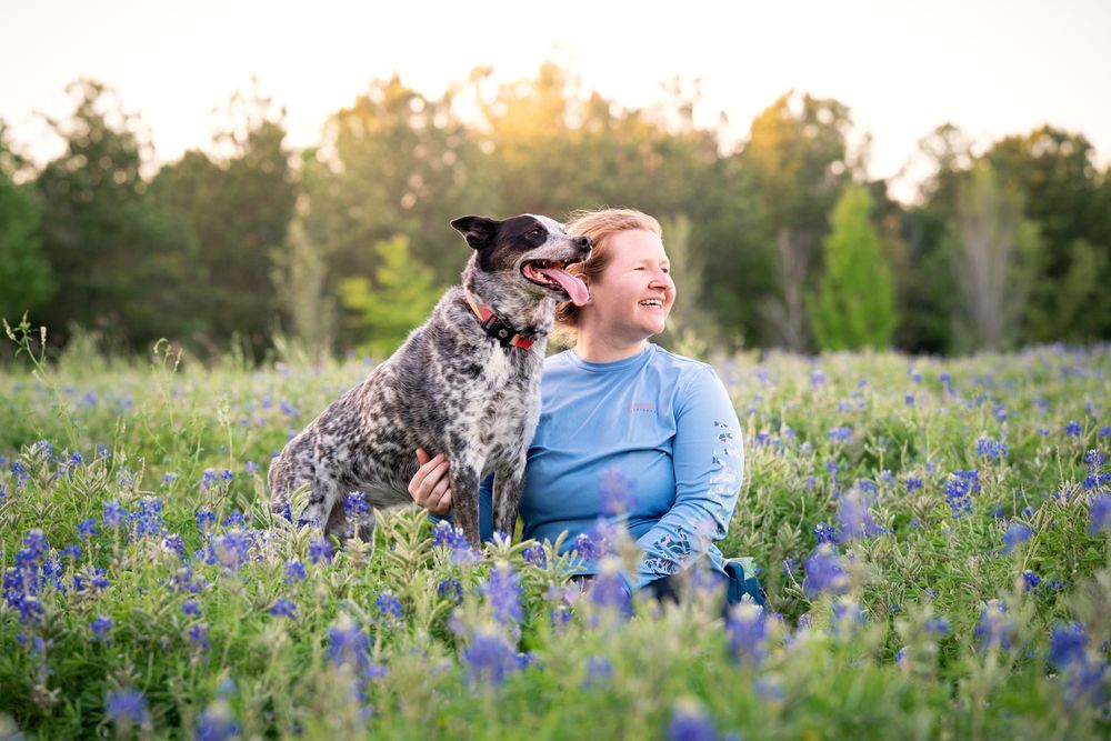 Authentic dog and owner portrait during a natural light pet photography session near Houston.