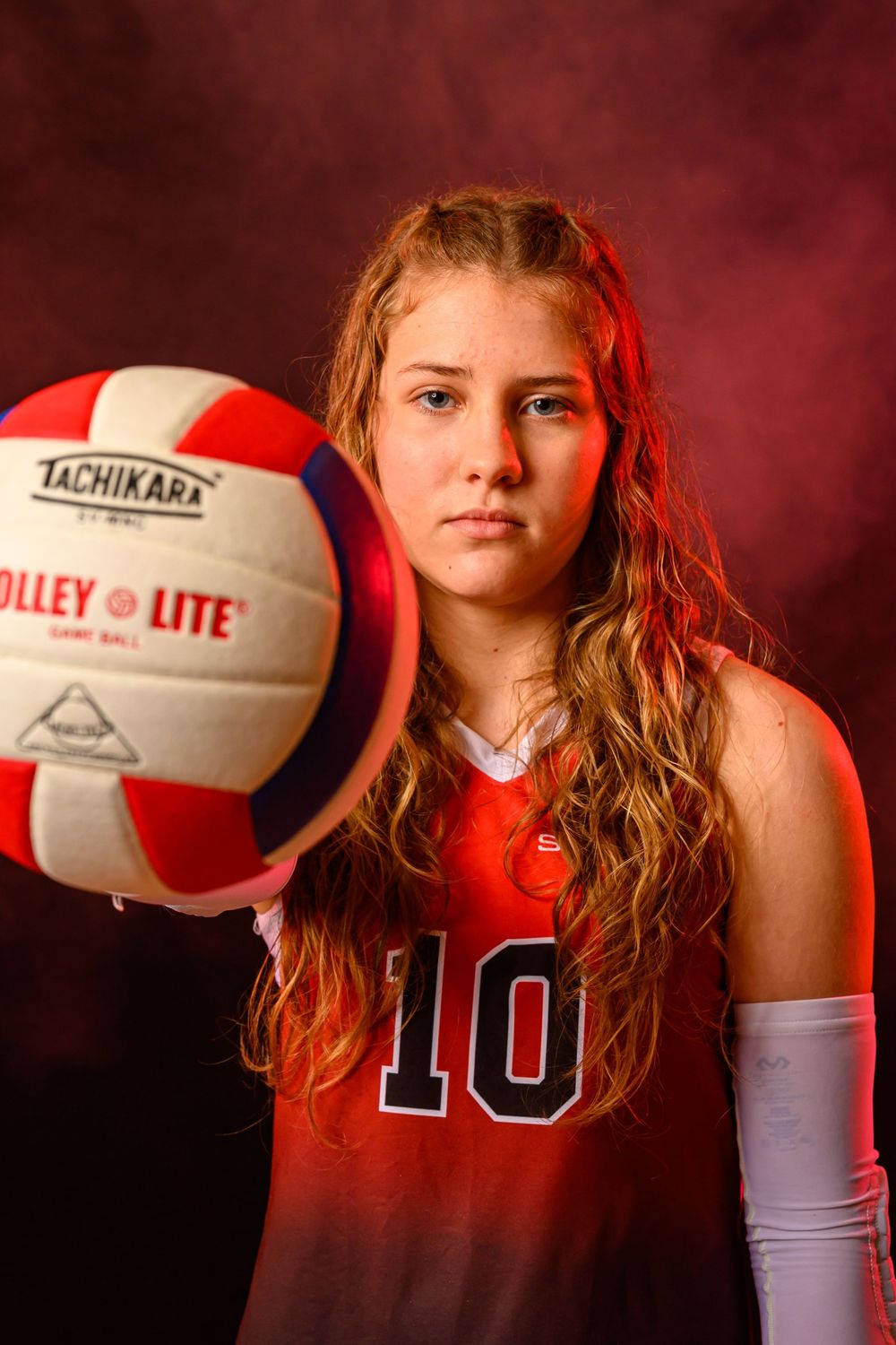 L Squared Photography sports portrait volleyball player holding ball