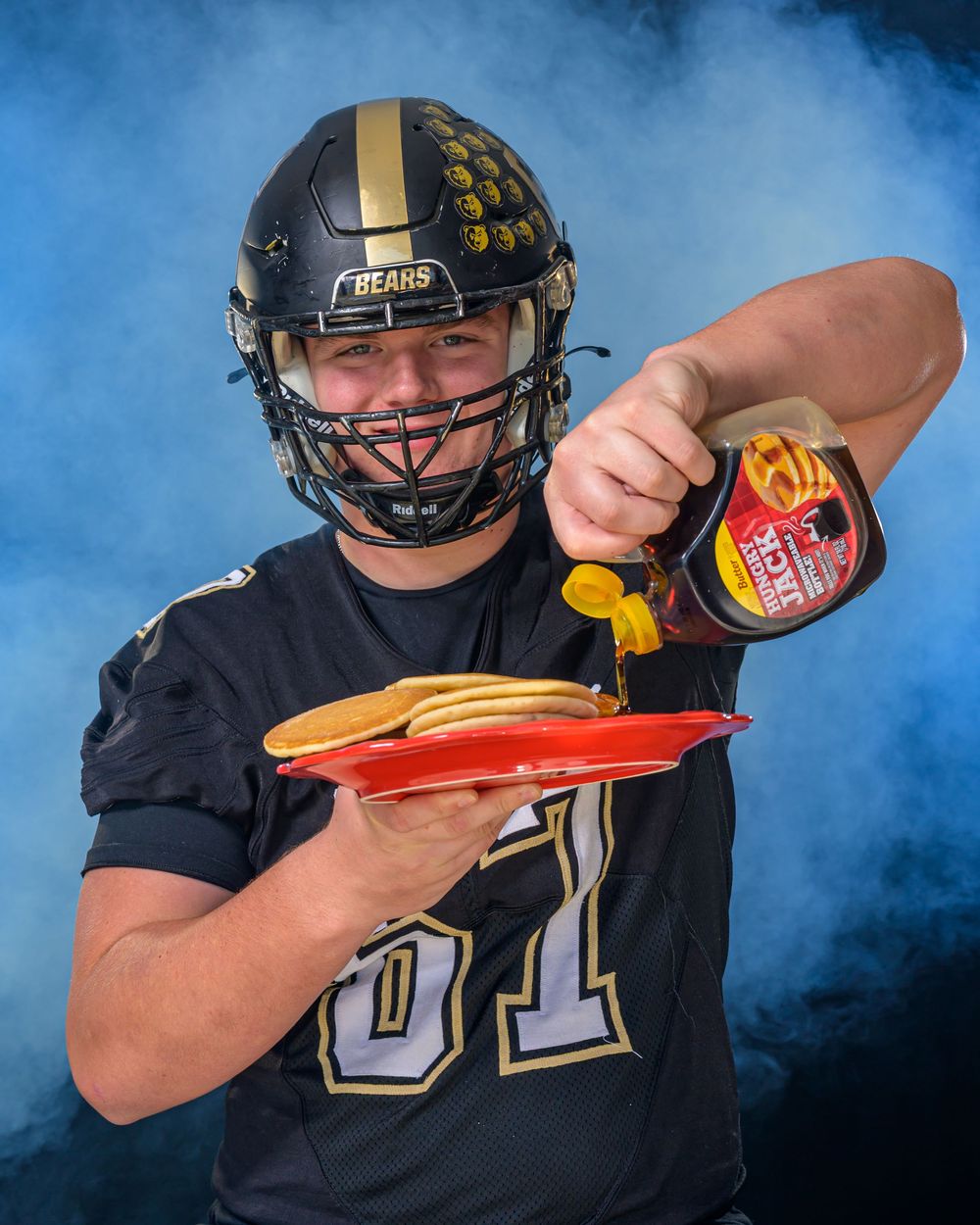 L Squared Photography sports portrait football player eating pancakes