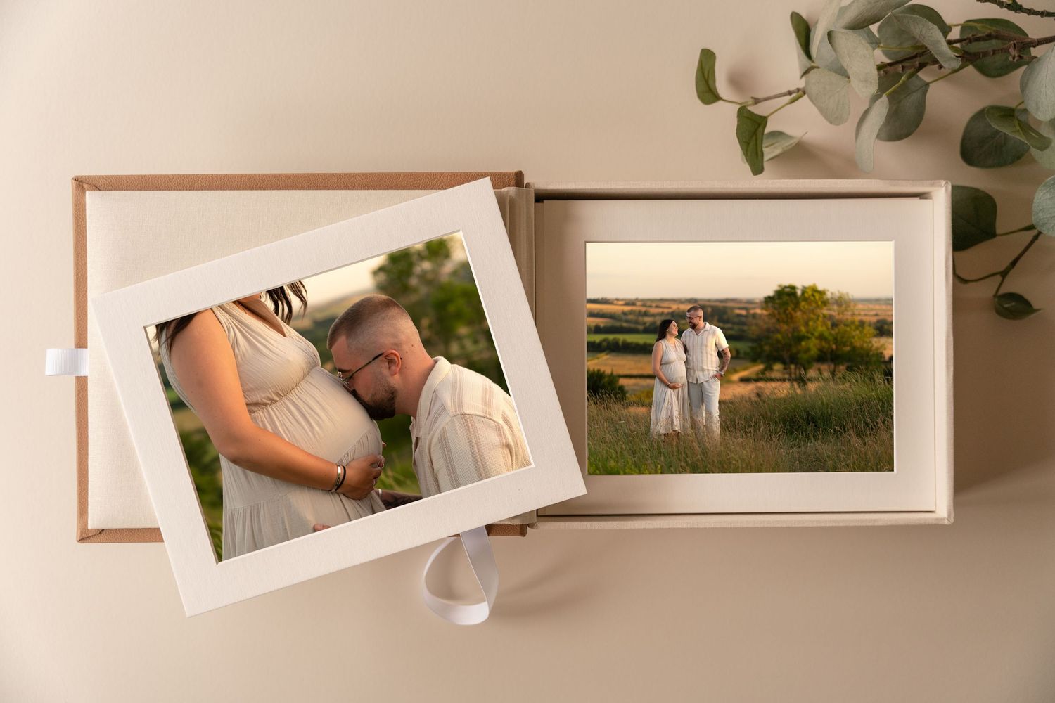 Framed family portrait photo displayed on a rustic wooden shelf beside a vase of pink flowers and a white ceramic mug.
