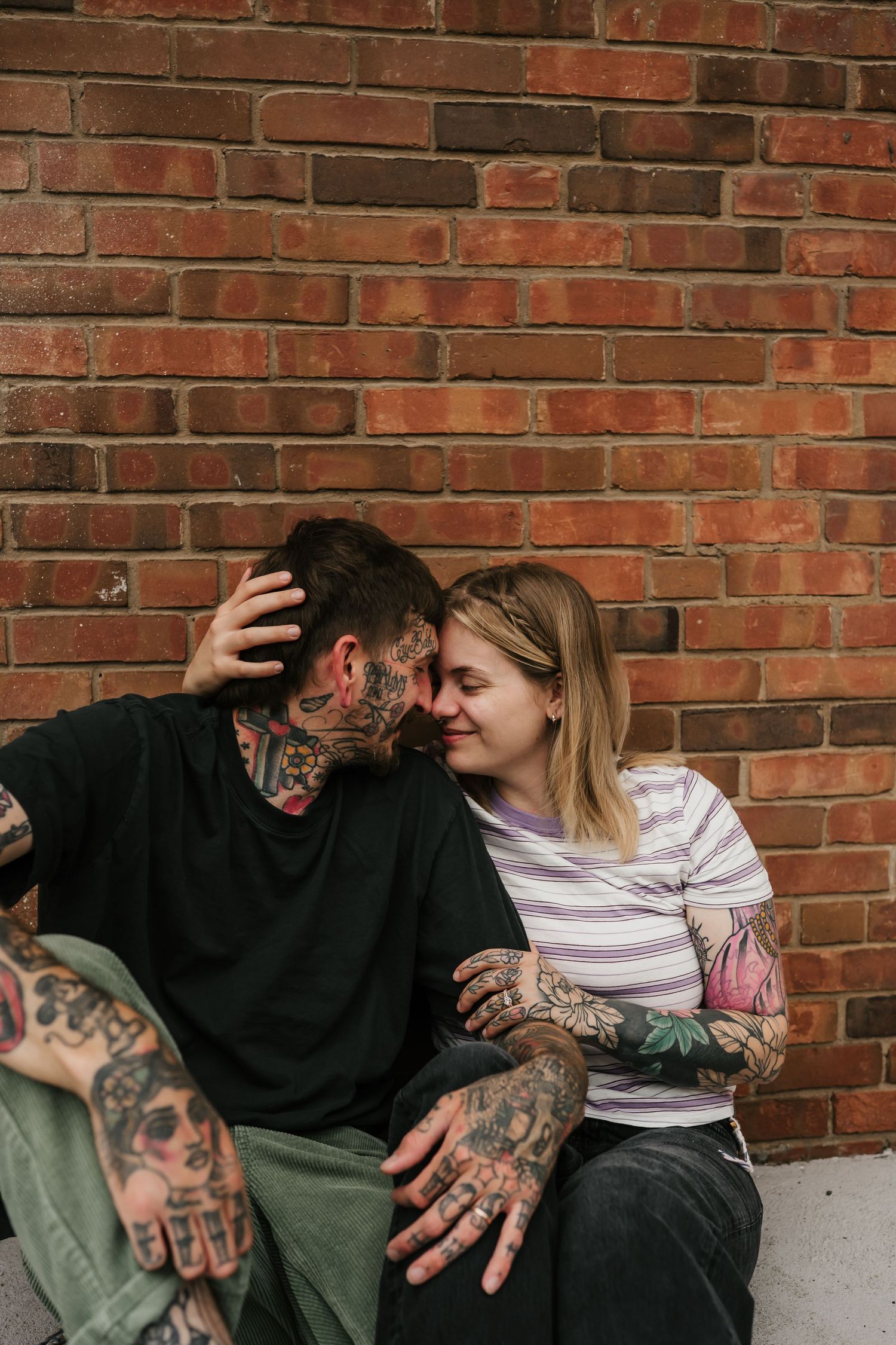 couple kisses during their anniversary photo session in cincinnati