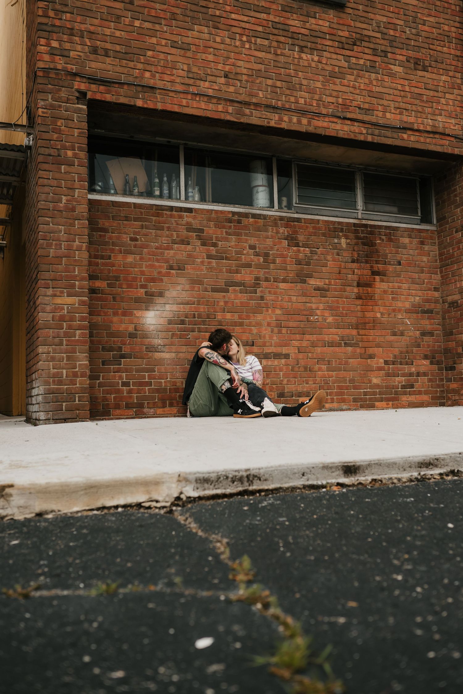 couple kisses during their anniversary photo session in cincinnati