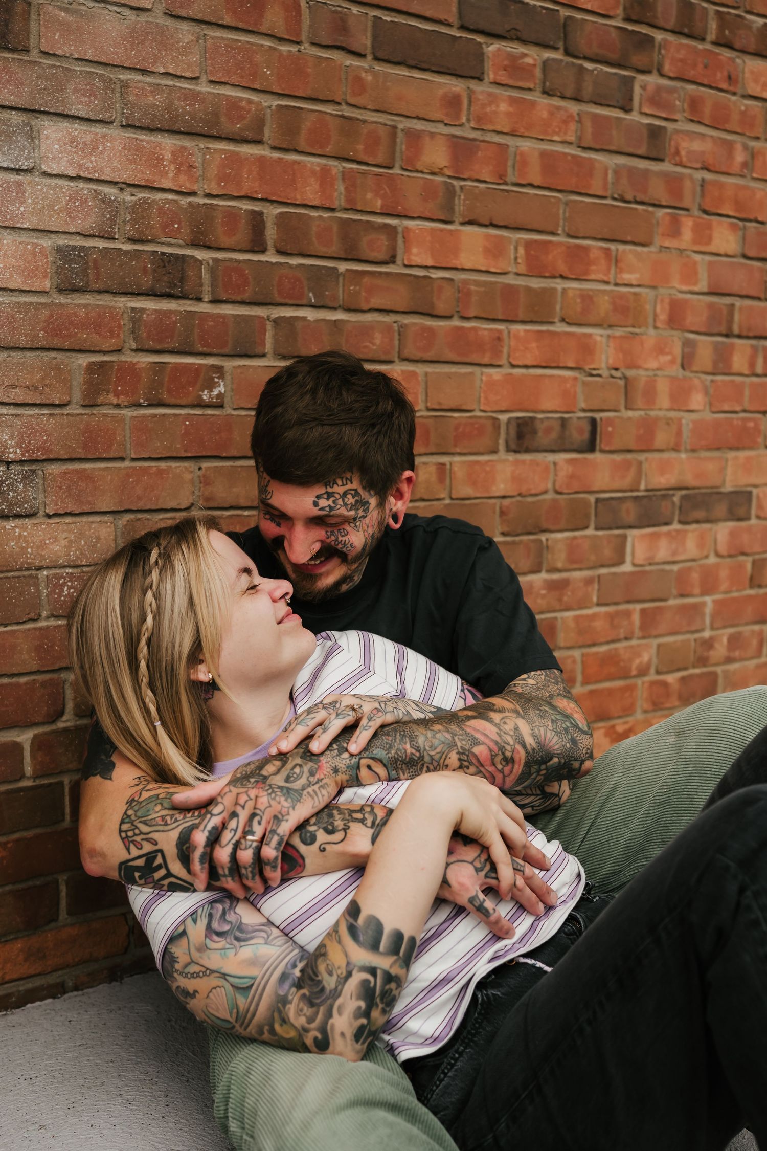 couple kisses during their anniversary photo session in cincinnati