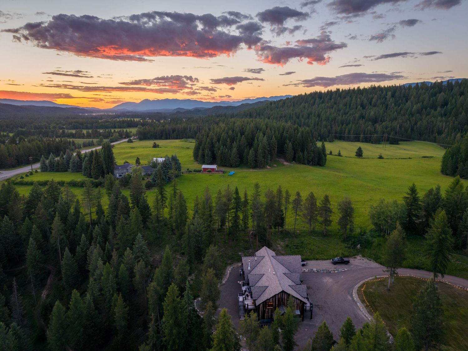Aerial/drone sunset shot of the micro resport, Bison Ridge Retreat in Whitefish, MT.