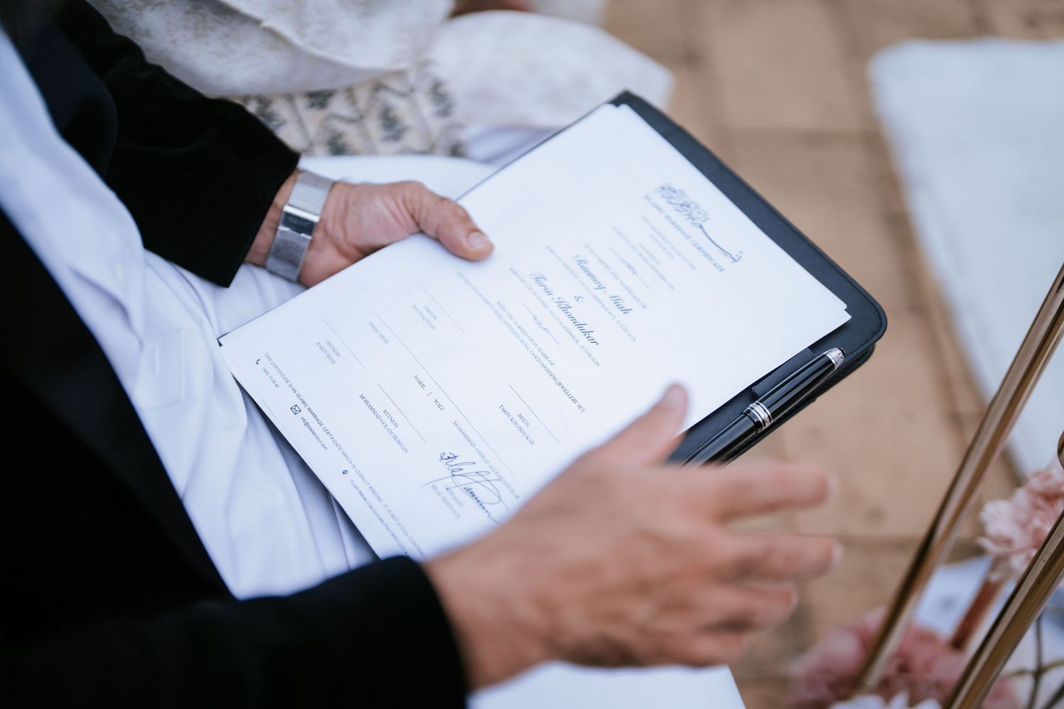 Imam with the Nikah certificate during an Islamic wedding ceremony in Sydney