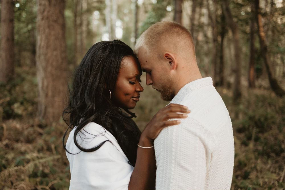 Natural close-up portrait of a couple together in the woods