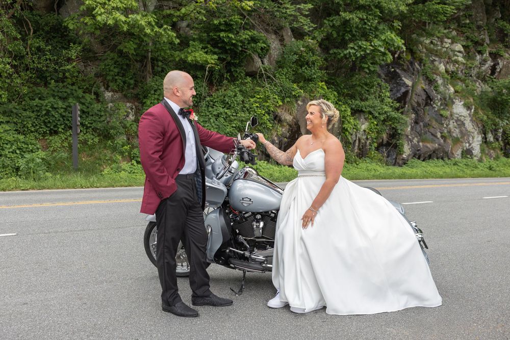 Bride and groom with their Harley Davidson motorcycle during a Shenandoah National Park elopement