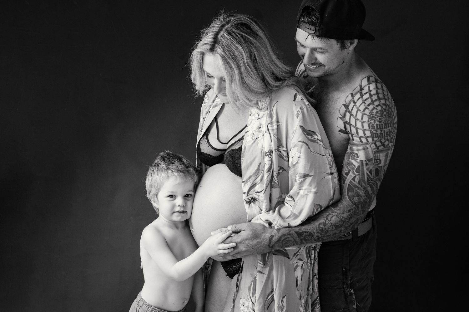Studio maternity photography celebrating pregnancy and motherhood with the family