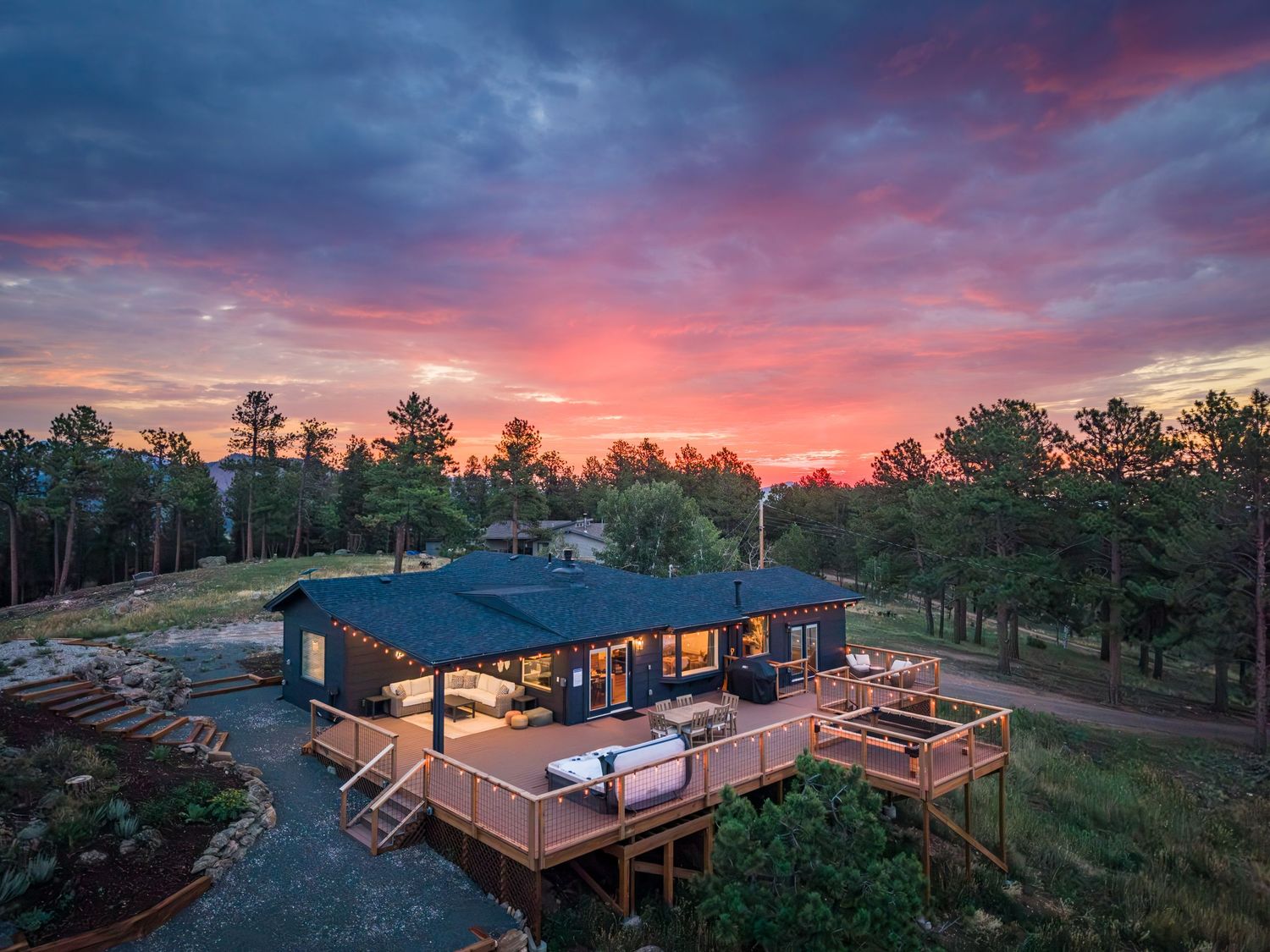 Aerial view of the short term rental property, the Selah House at sunrise in Bailey, CO.