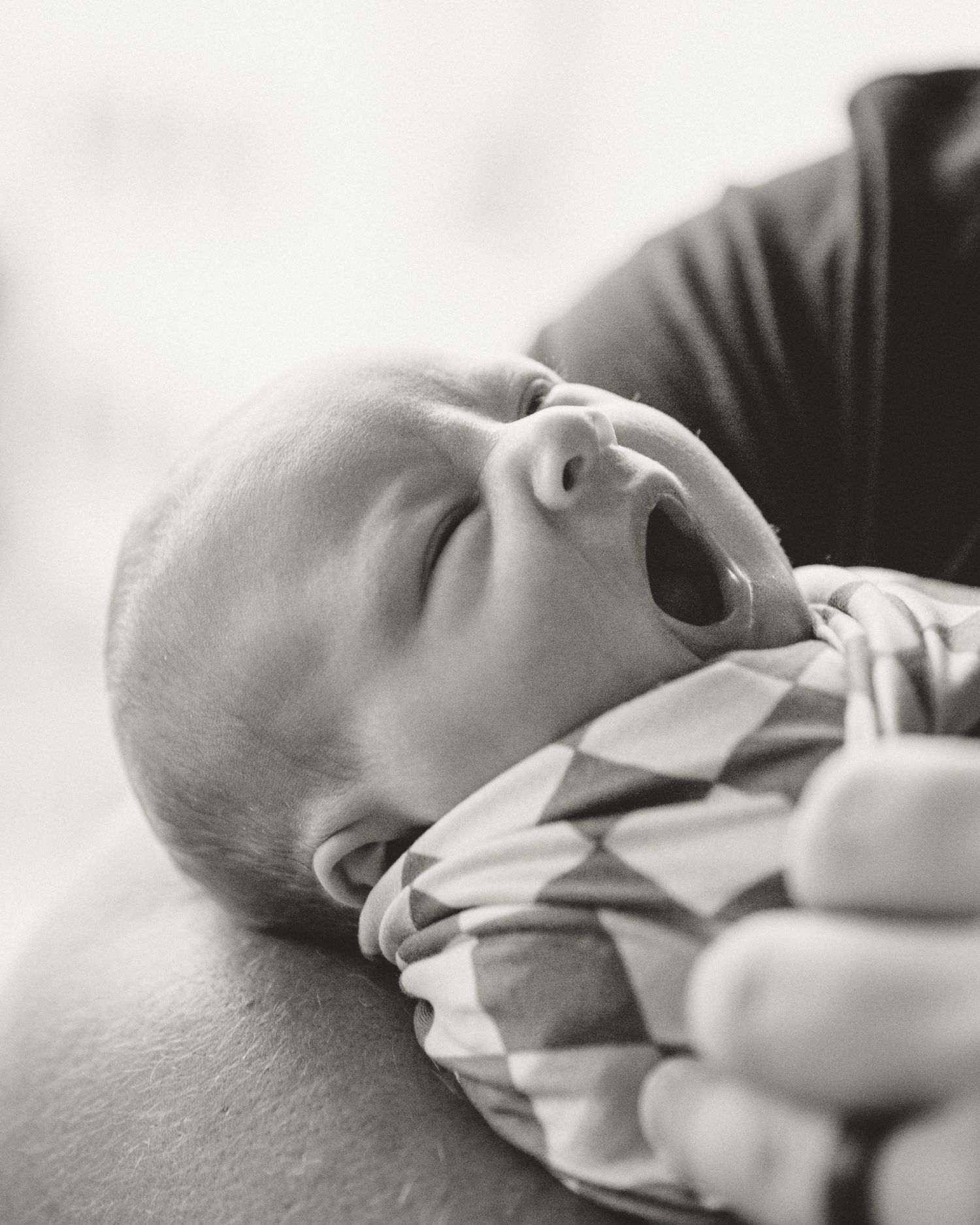 Close up shot of baby yawning during fresh 48 session in Tyler Tx hospital