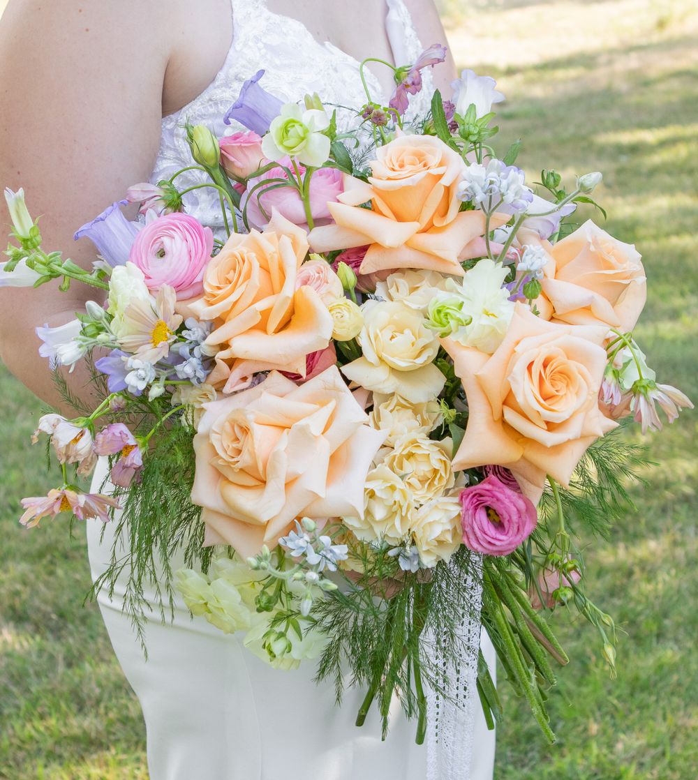 bridge holding a beautiful bouquet of wedding flowers in strongsville
