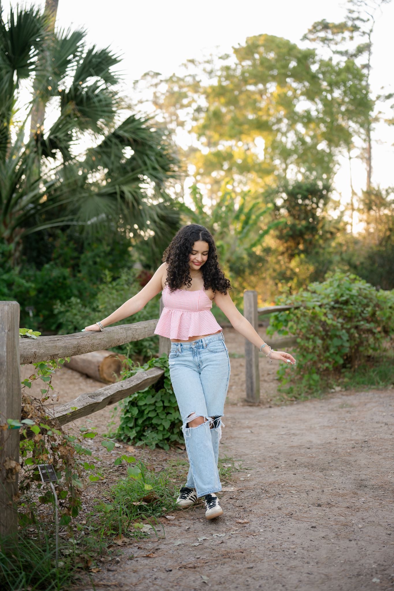 Cristina playing during her outdoor senior photography session.