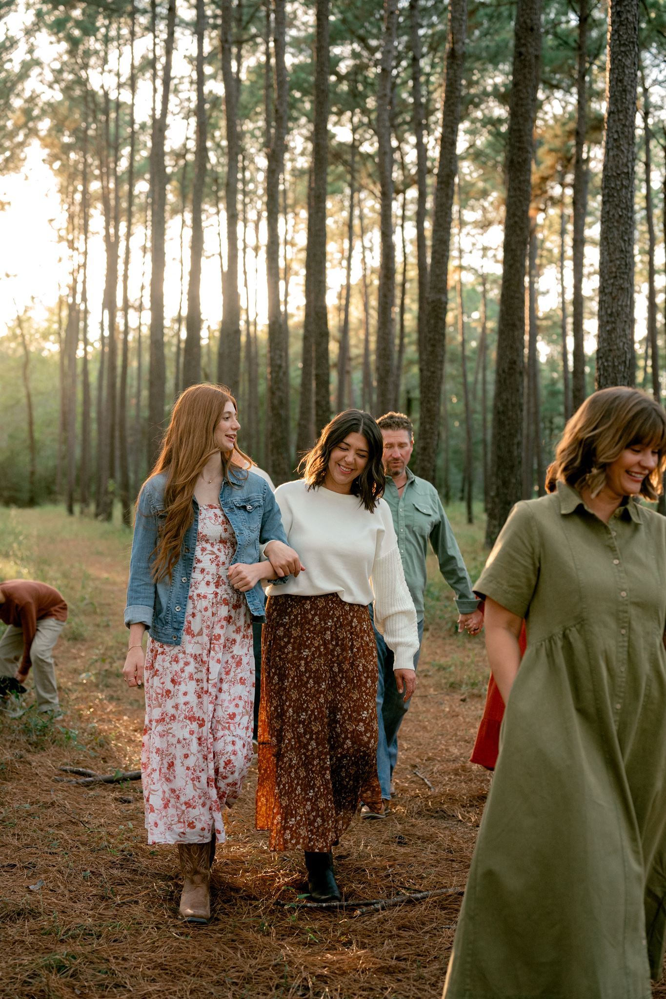 Candid photograph of family members laughing together during their Conroe photo session.