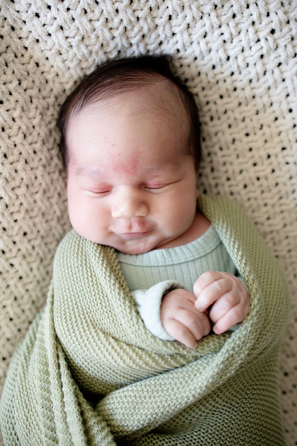 Baby boy during a newborn lifestyle session in Oak Ridge, TN with Nina Thomas Photography.