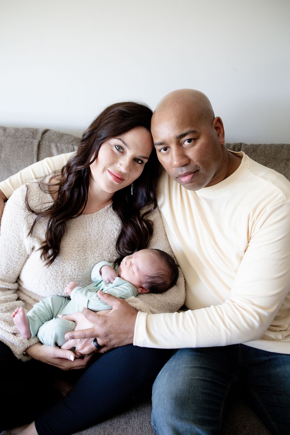 Family of 3 during a newborn lifestyle session in Oak Ridge, TN with Nina Thomas Photography.