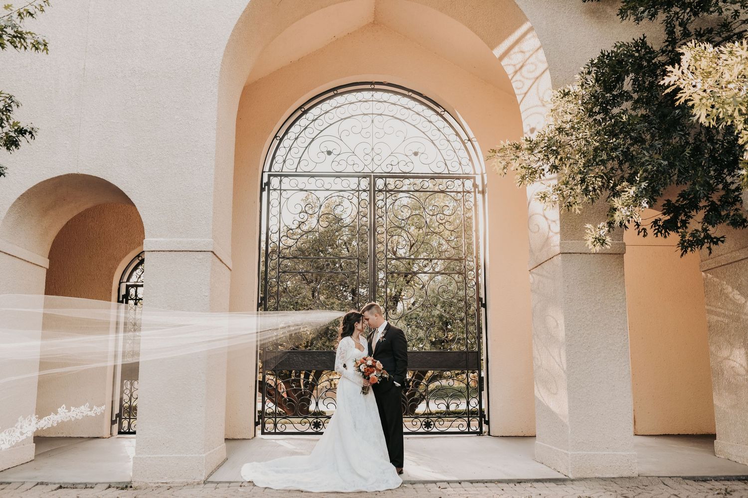 Wedding party portraits in courtyard at St Ann Catholic Parish