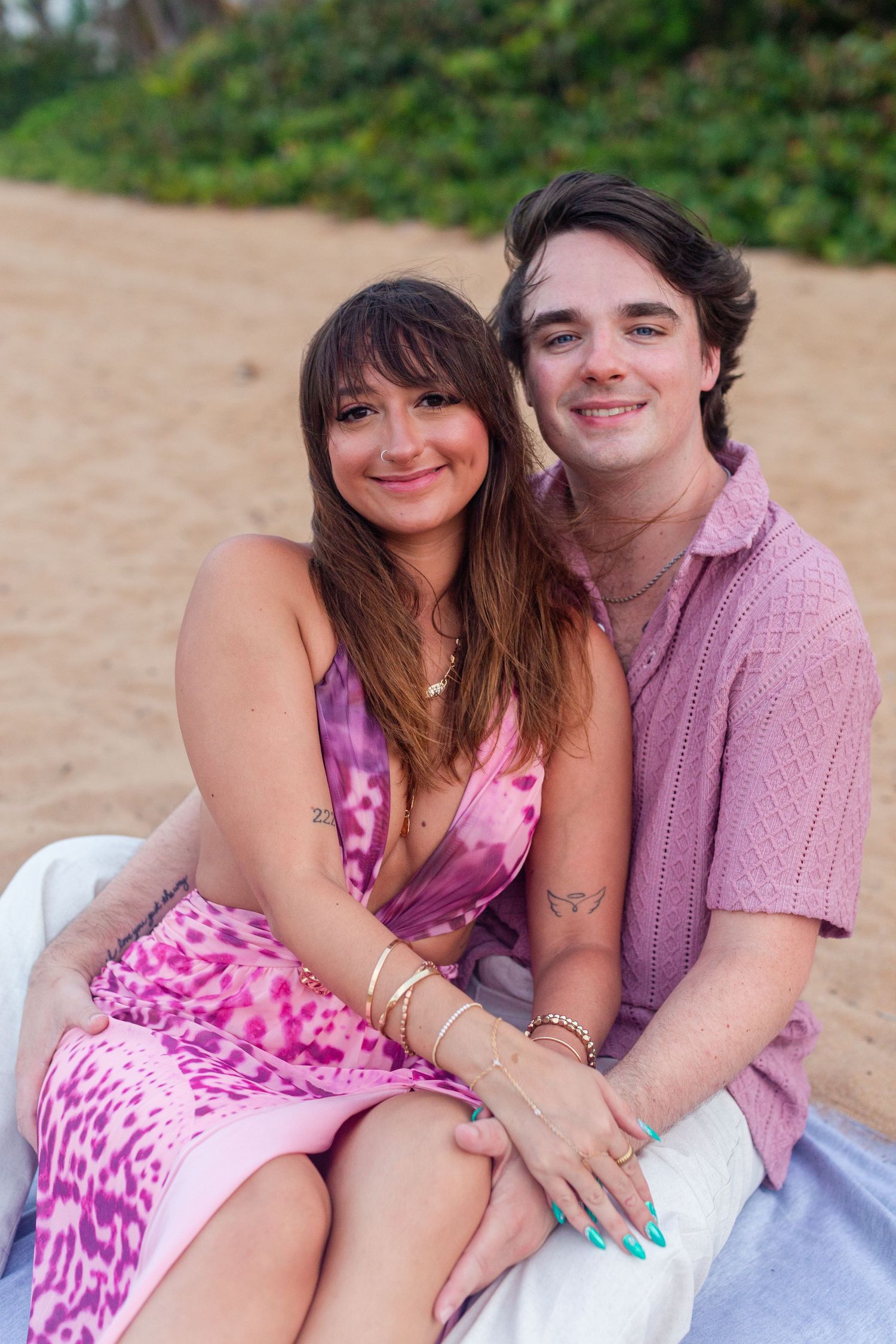 Couples portrait on the beach. Seated on a blanket. Río Grande, Puerto Rico.