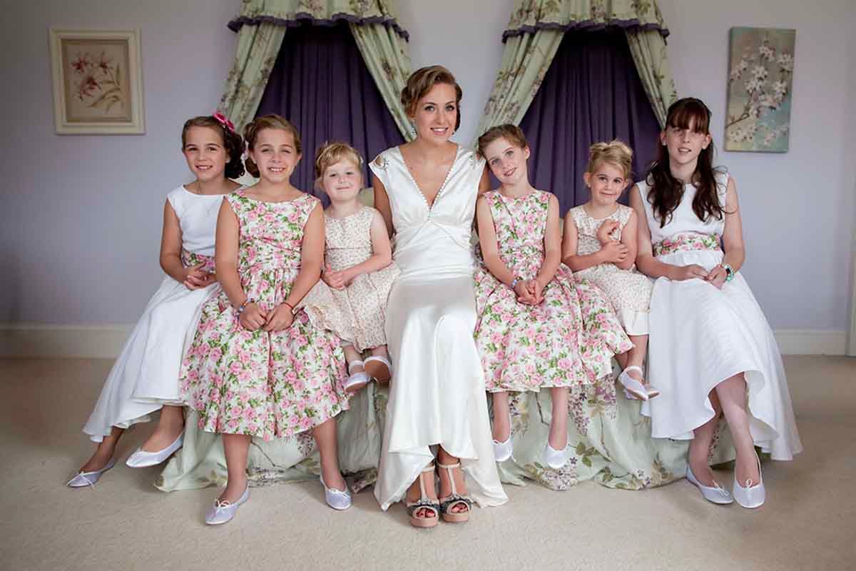 bride and bridesmaids sit in the bridal suite moments before entering the marriage hall