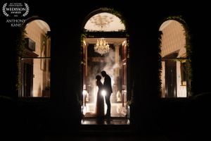 Romantic silhouettes in ornate doorways with dramatic lighting and chandelier in Lyrath estate