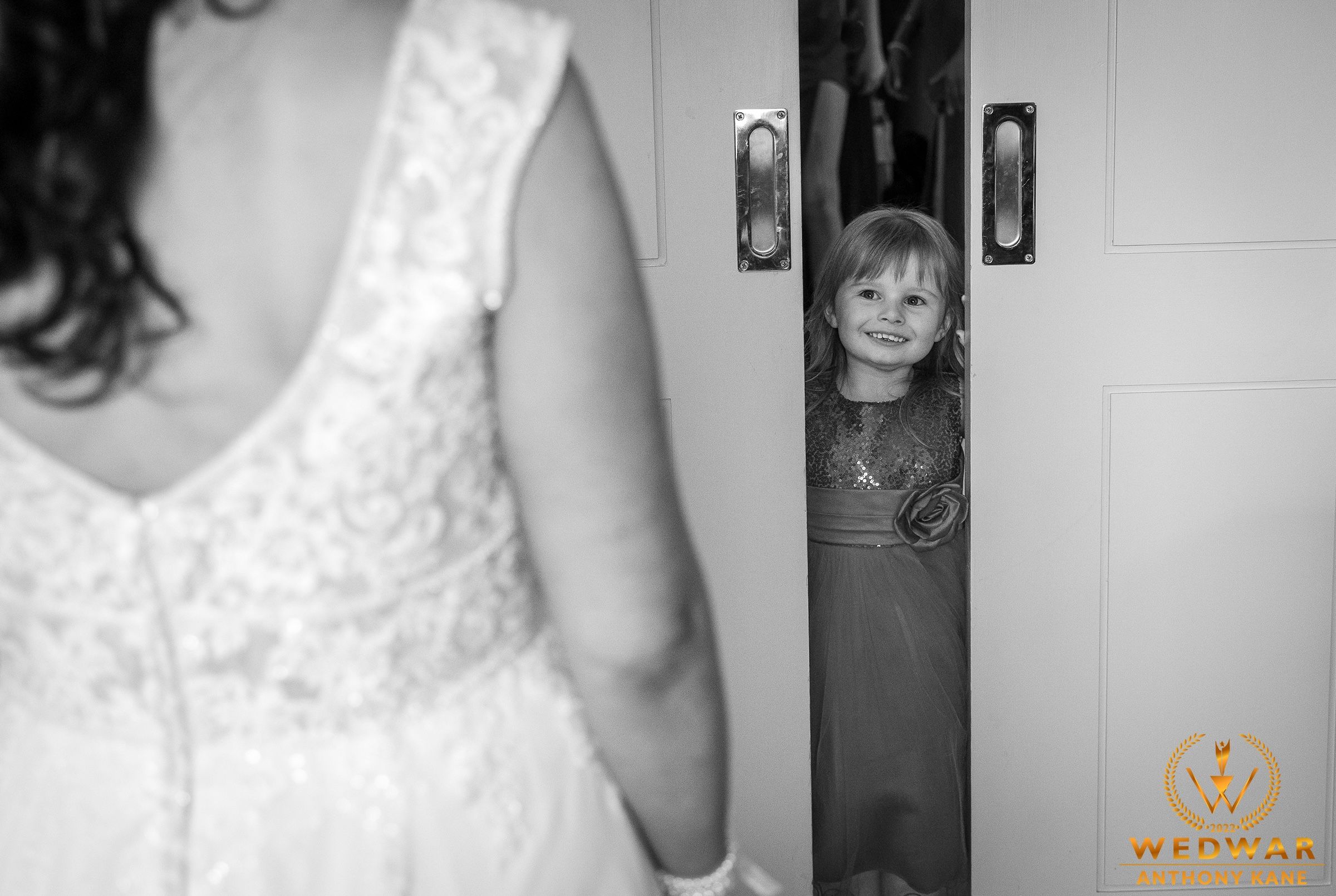 First look between mom and daughters  wedding dress in black and white photography in Druids Glen.