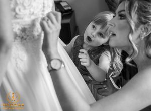 Black and white collage of wedding preparation moments showing makeup application and styling.
