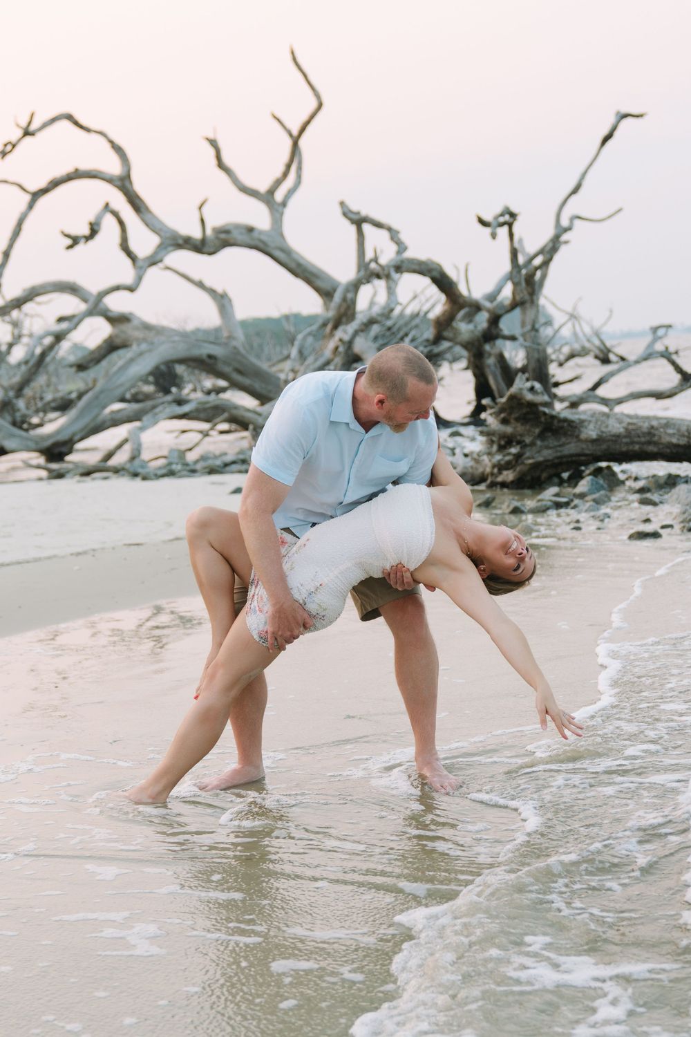 Rachel smiles during her beach engagement portrait session on Jekyll Island, Georgia