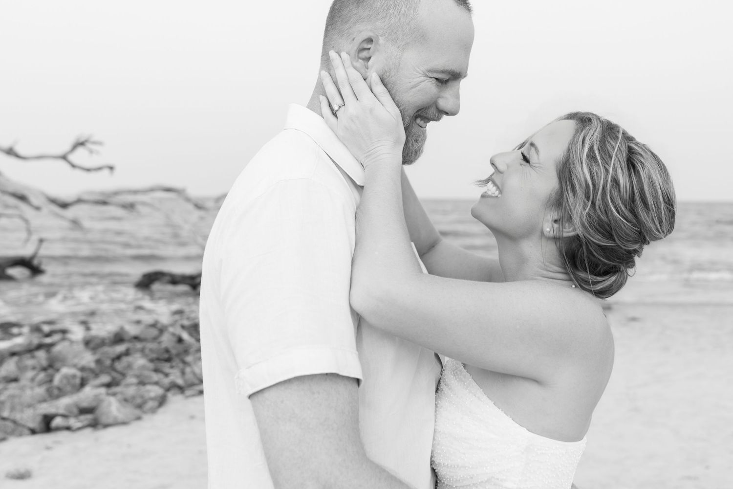 Black and white engagement portrait of Rachel and Bo together on Jekyll Island
