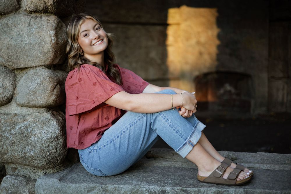 Girl posing for senior photo in a unique location