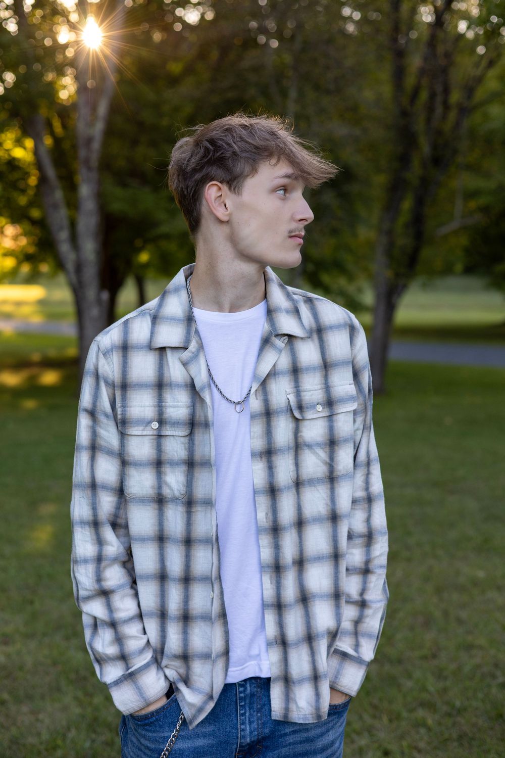 Boy posing for senior photo during a golden hour session in Belchertown, MA