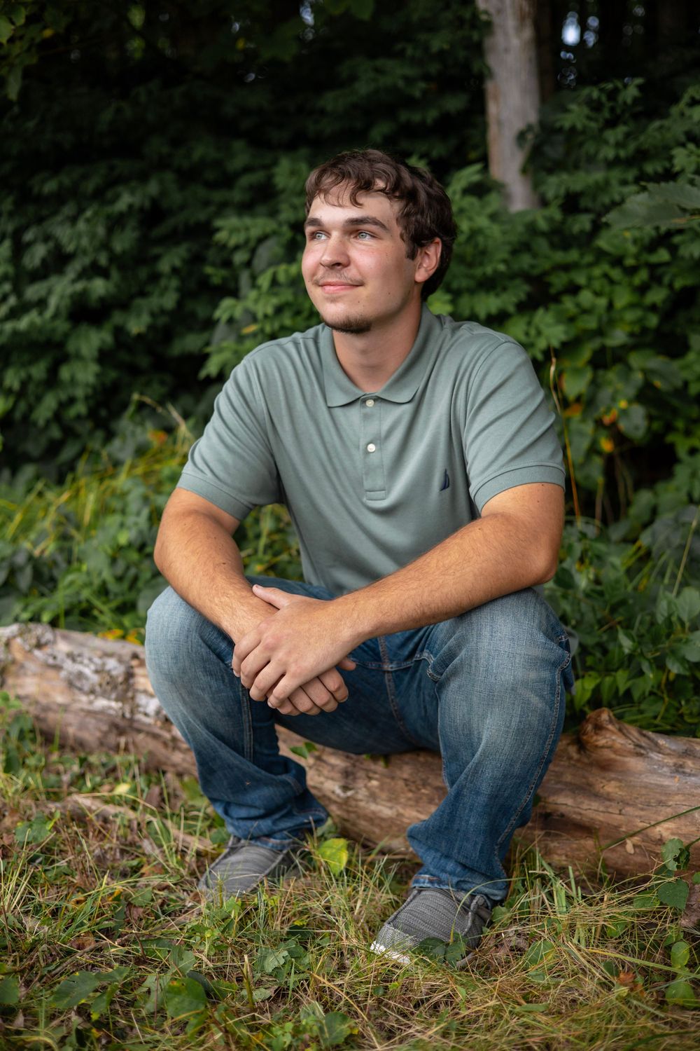 High school senior sitting outside for photo session in Western MA