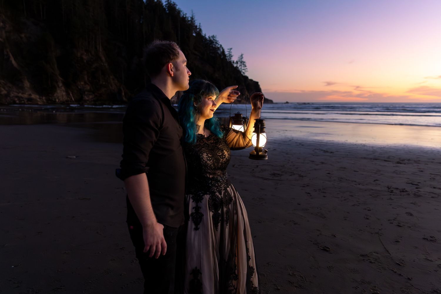 Silhouette of a couple sharing a romantic kiss on the beach at sunset with golden sky and ocean backdrop.