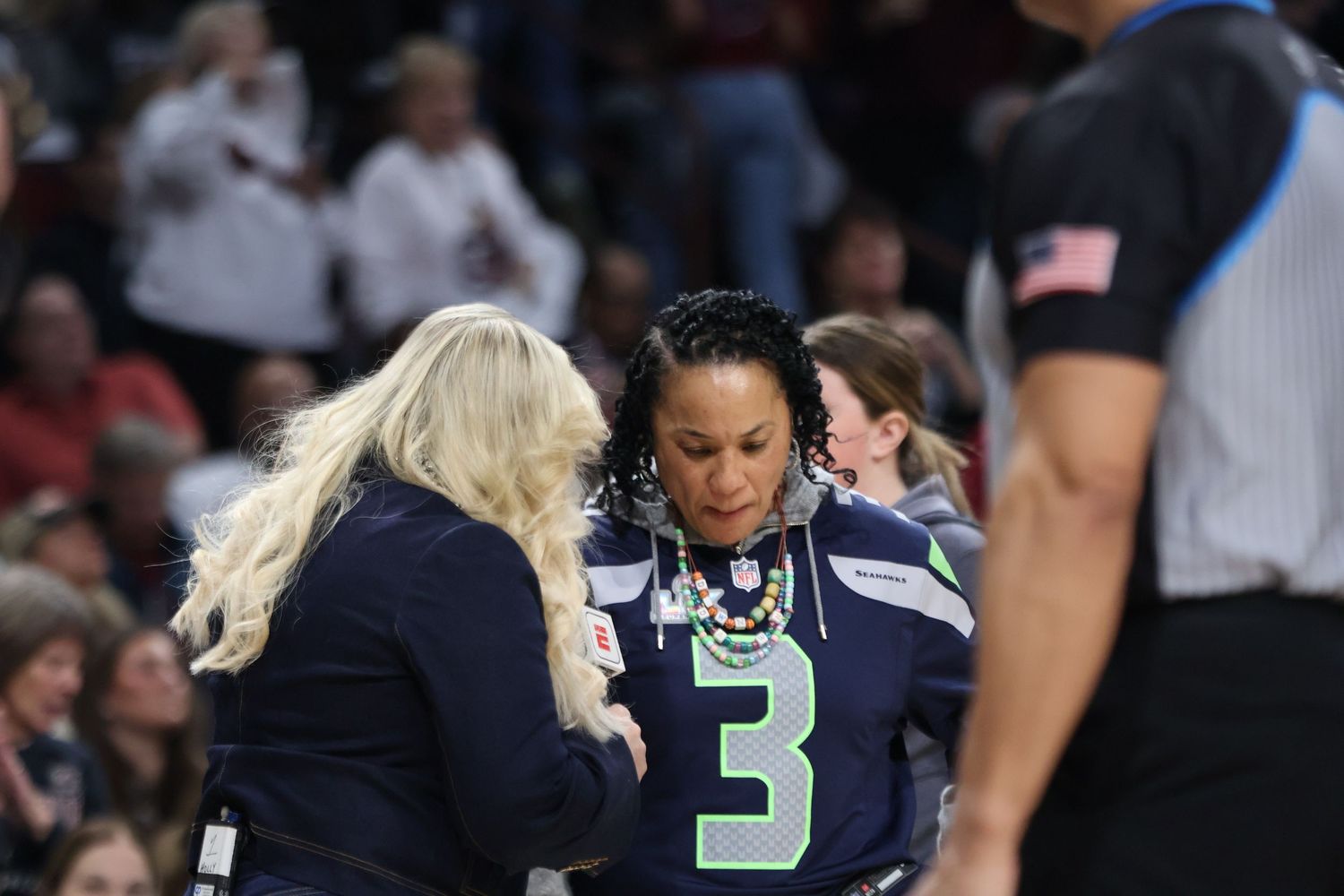 Coach providing interview with ESPN  Holly Rowe during SEC Basketball contest versus Tennessee