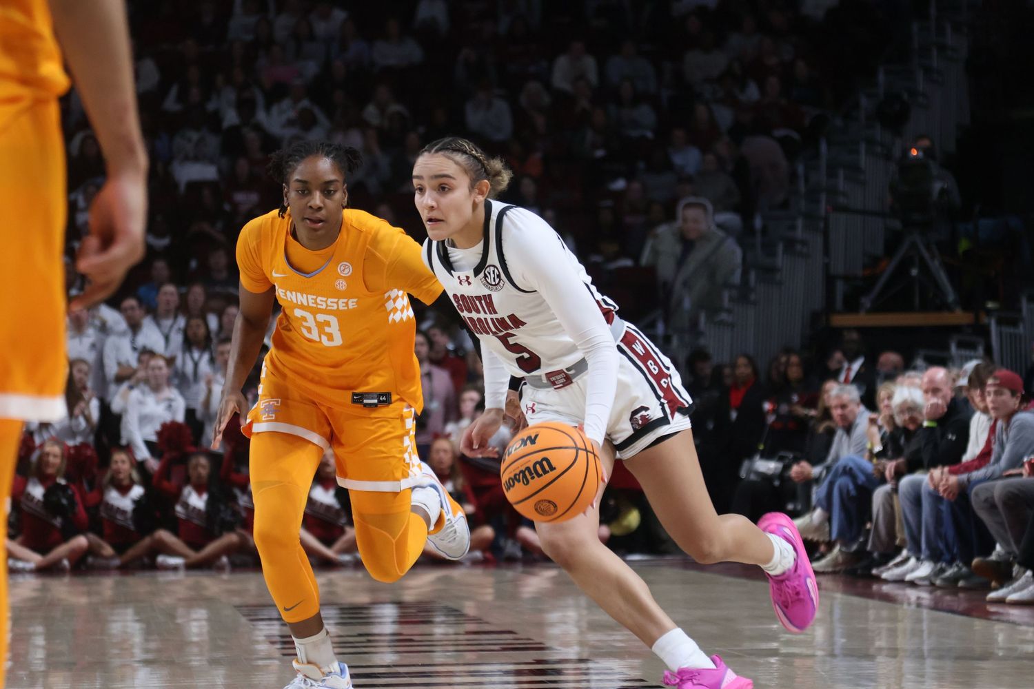 South Carolina basketball guard drives past a Tennessee defender.