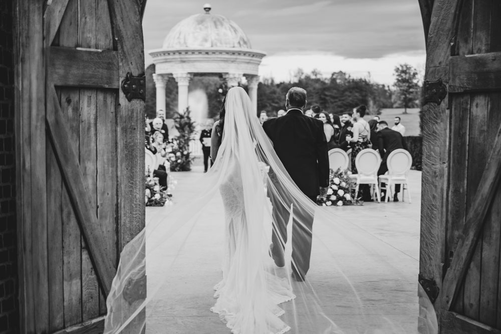 Black and white wedding ceremony photos showing guests gathered around a gazebo in an outdoor setting.