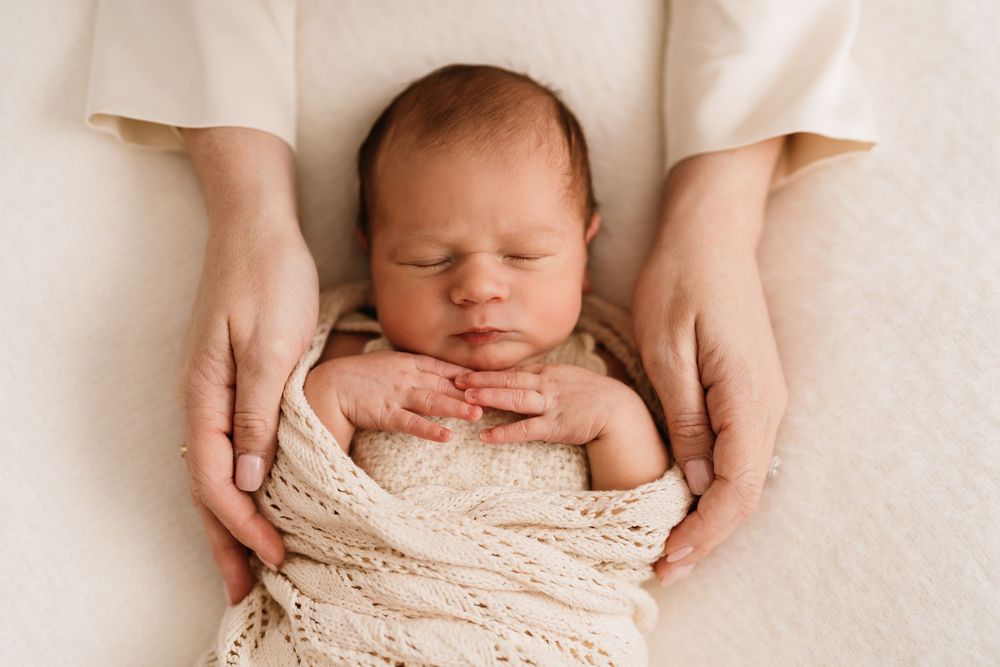 Soft newborn portrait focusing on baby’s features
