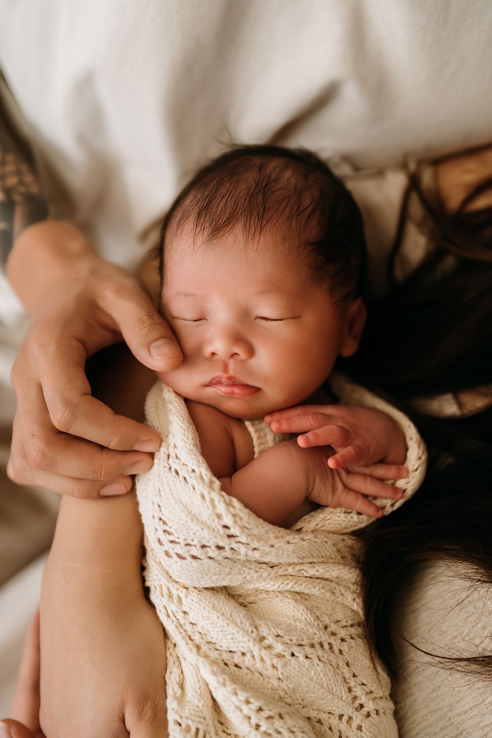 Close-up of newborn baby hands during lifestyle photography session