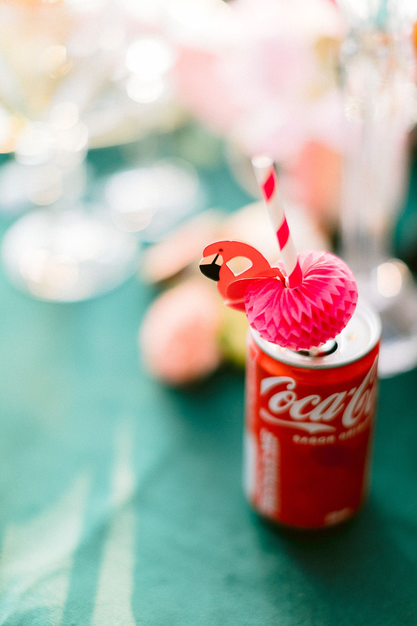 Colorful cocktails and floral centerpiece at outdoor wedding reception.
