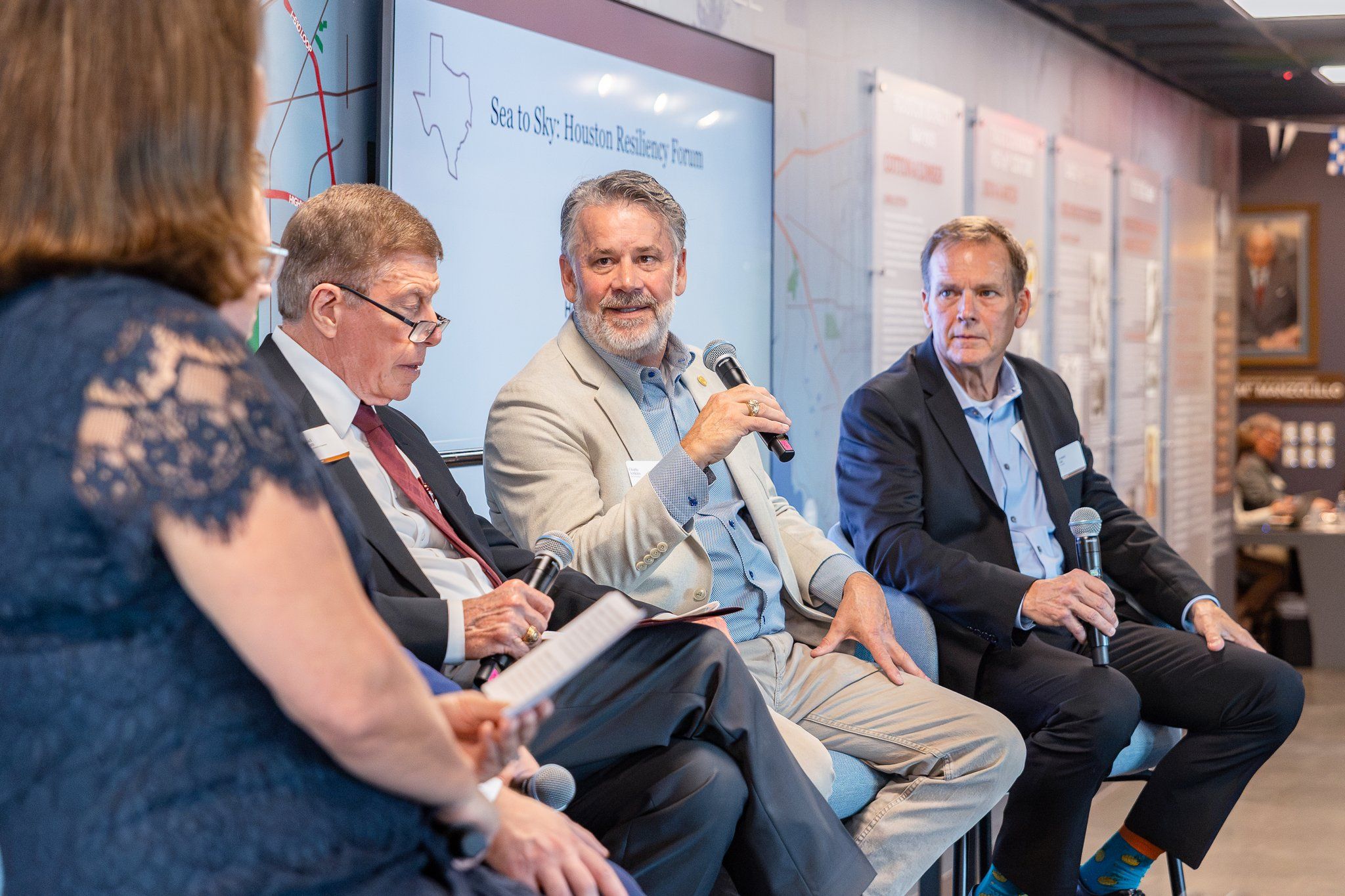 Keynote speaker addressing corporate executives during a professional business forum in Houston, TX