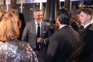 Corporate guests networking and socializing during an upscale business cocktail reception in Houston, TX