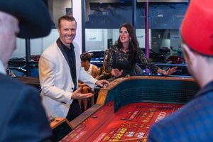 Guests playing roulette at a themed corporate casino night event fundraiser in Houston, TX