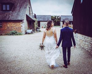 Bride and groom walking shot Huntsmill Farm Shalstone Buckingham