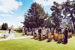 Outdoor wedding photography bride walks down aisle Haytor Hotel Dartmoor