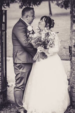 Archway to the Rose Garden Cockington Court micro wedding bride and groom