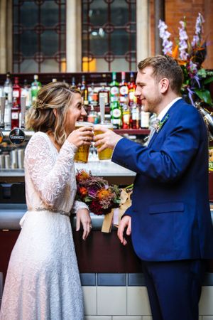 Wedding Photography bride and groom pint of lager Kings Cross St Pancras Station