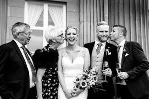 Wedding Photography mother of the groom kisses the bride The Mansion Roundhay Park Leeds