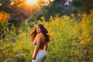 capturing the sunset and a candid spin, this senior picture has it all