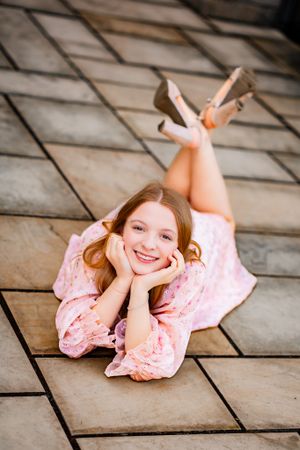 A senior girl takes a beautiful posed senior photo